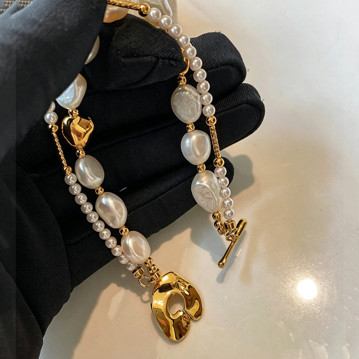 Dames Dubbele Parel Bedelarmband Goudkoper Look 1
