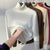 Damessweater met coltrui en fluwelen voering